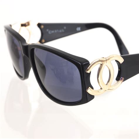 chanel sunglasses with chanel written on top|chanel sunglasses logo on side.